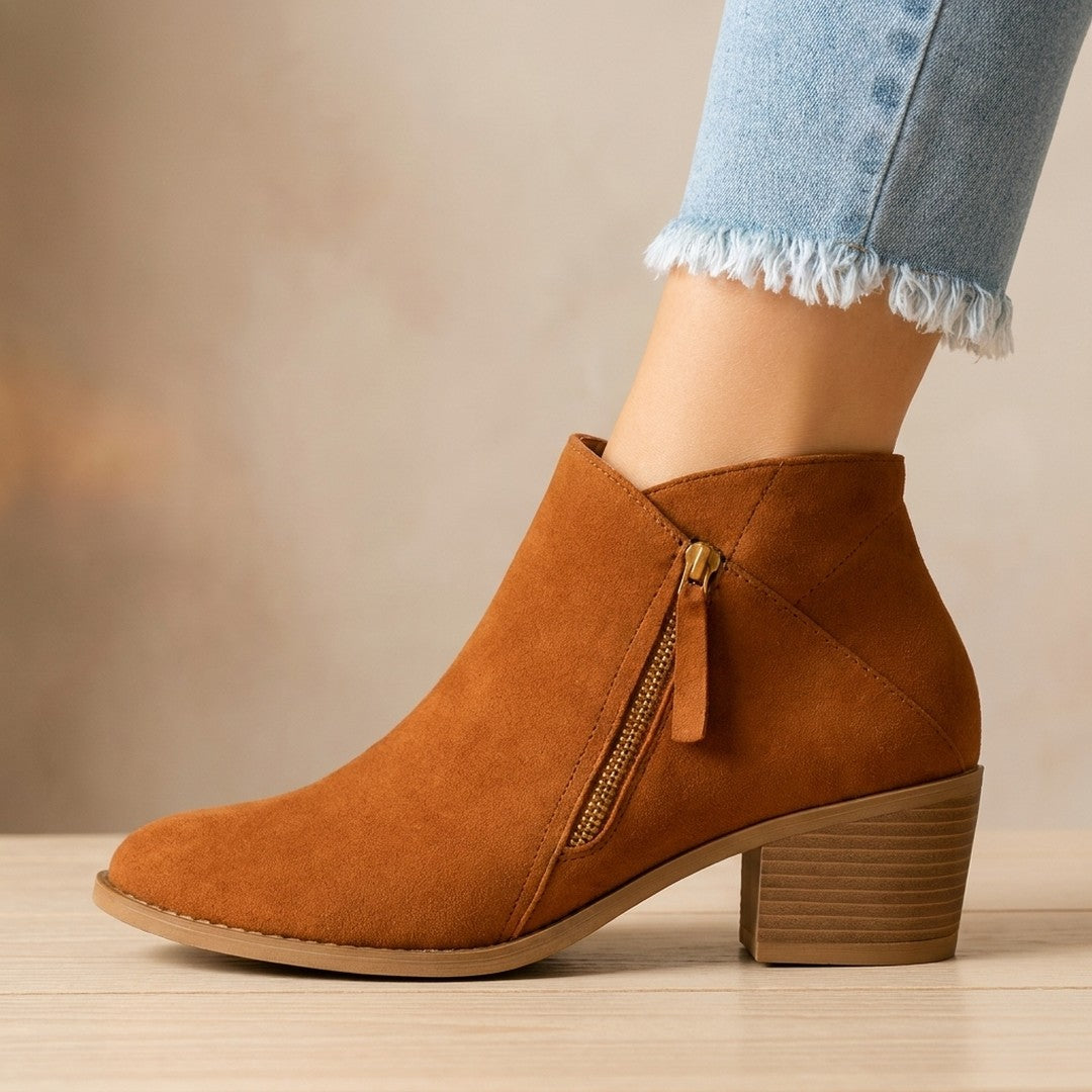 Woman wearing the Anais women's casual zip-up boots, side view
