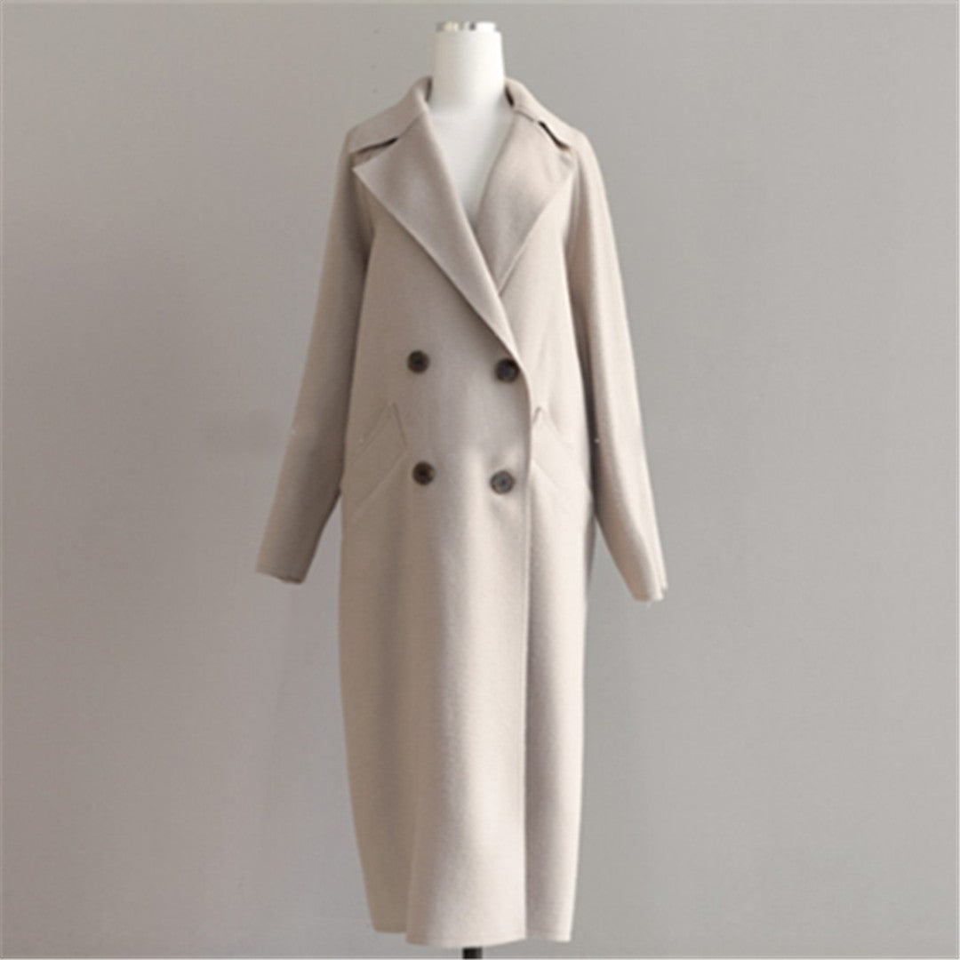 Woman wearing the Arwen women's wool long-sleeve coat, back view