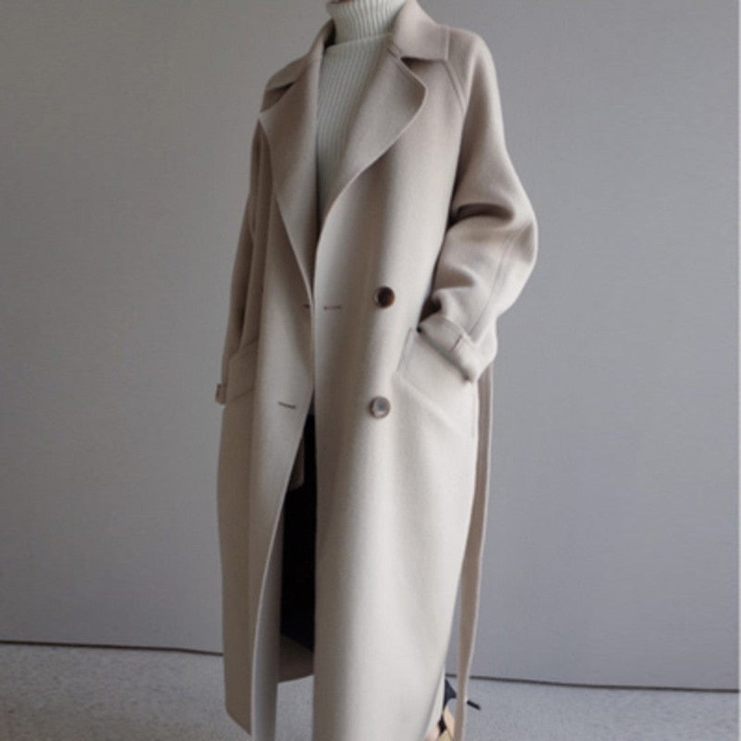 Woman wearing the Arwen women's wool long-sleeve coat, detail view