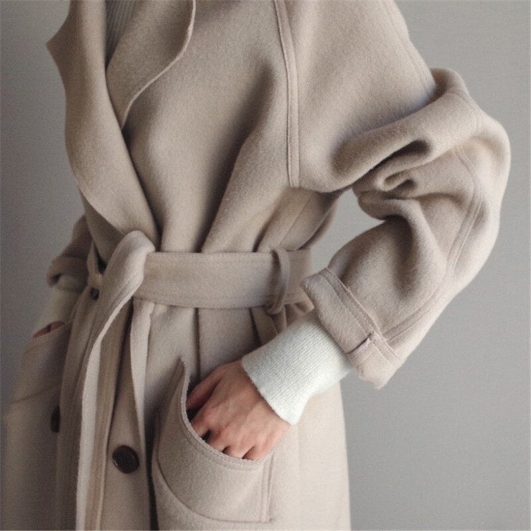 Woman wearing the Arwen women's wool long-sleeve coat, front view