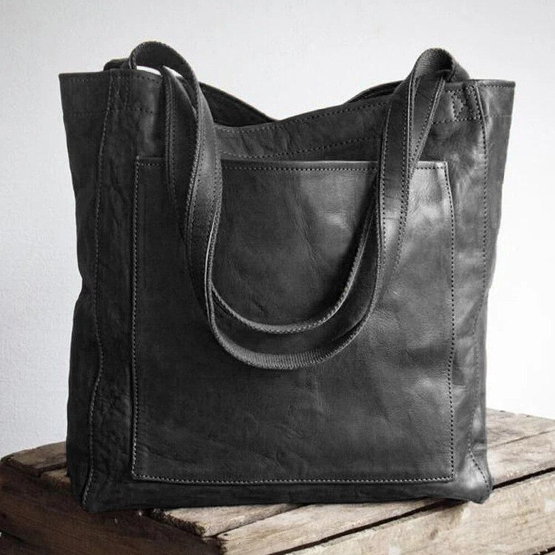 Woman wearing the Bristol women's pocket detail bag, flatlay view