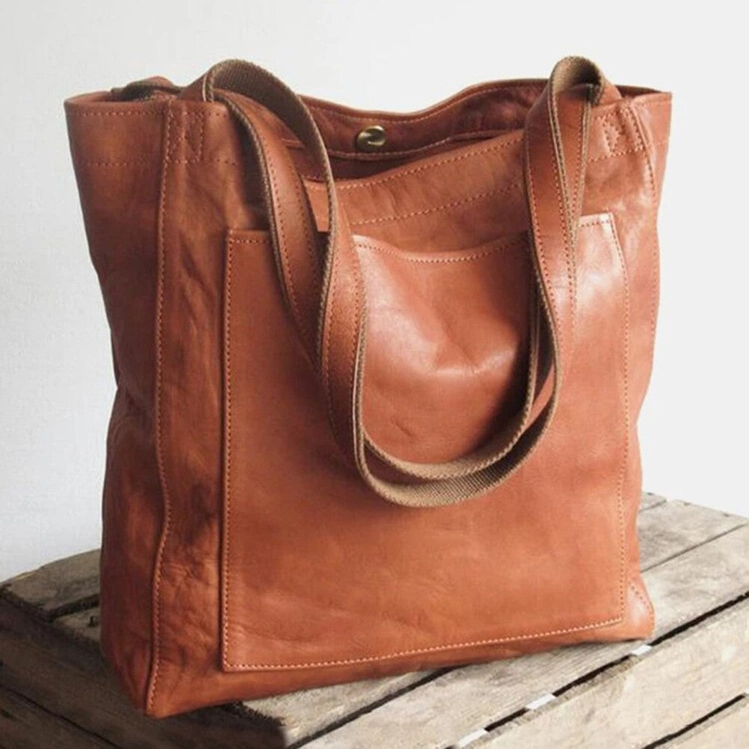 Woman wearing the Bristol women's pocket detail bag, front view