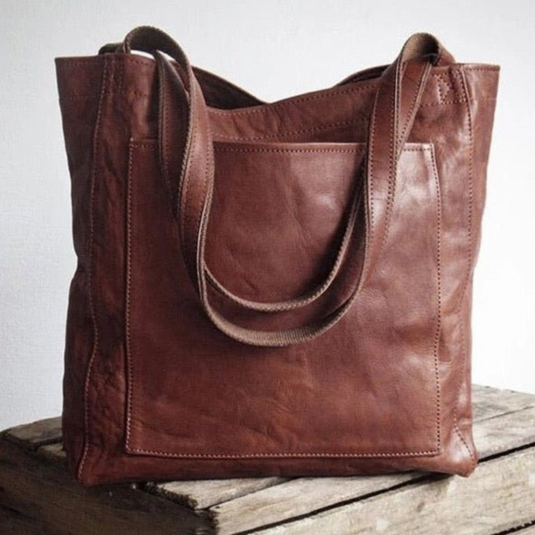 Woman wearing the Bristol women's pocket detail bag, model view