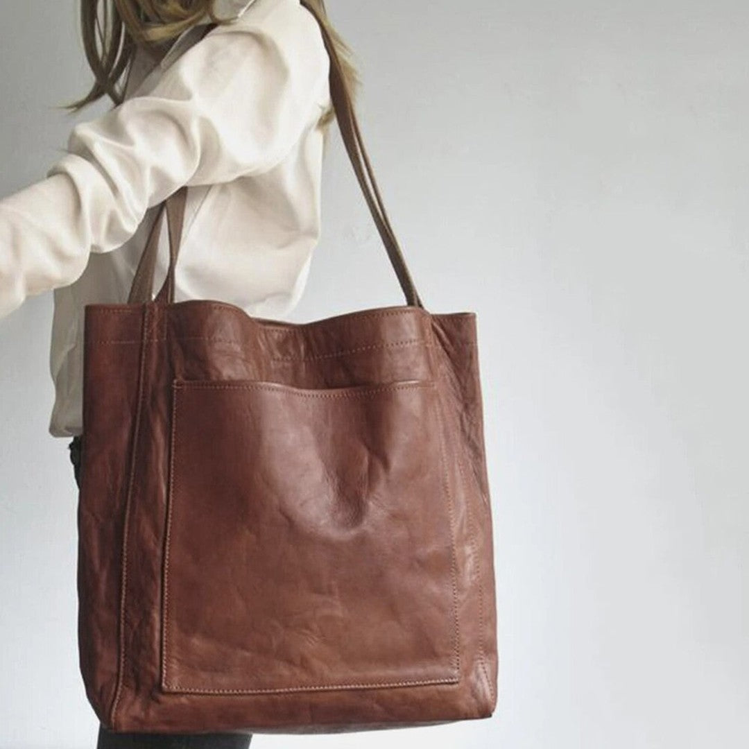 Woman wearing the Bristol women's pocket detail bag, side view