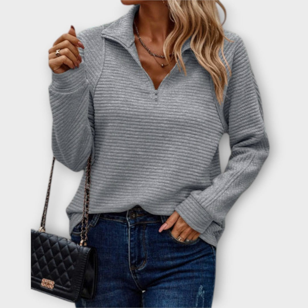 Woman wearing the Claire women's sweater, side view