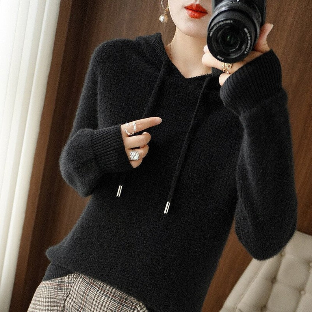 Woman wearing the Cora women's hooded cashmere hoodie, back view