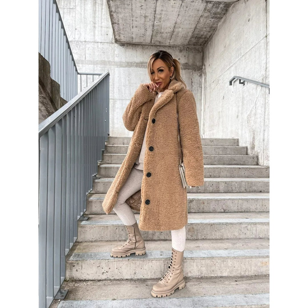 Woman wearing the Daphne women's coat, model view