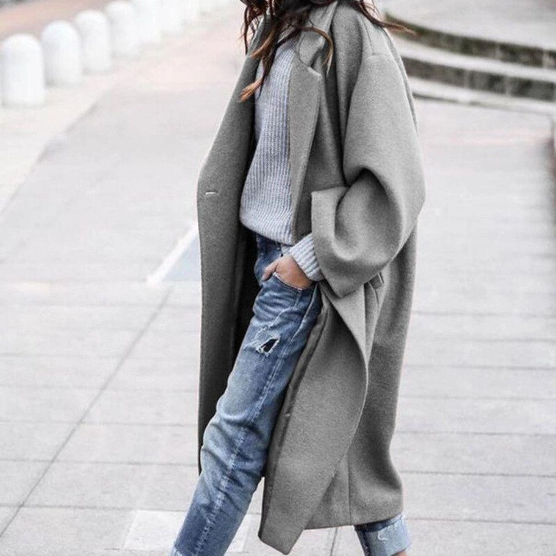 Woman wearing the Eliza women's elegant coat, side view