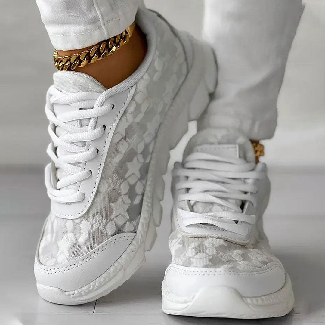 Woman wearing the Elodie women's sneakers, back view