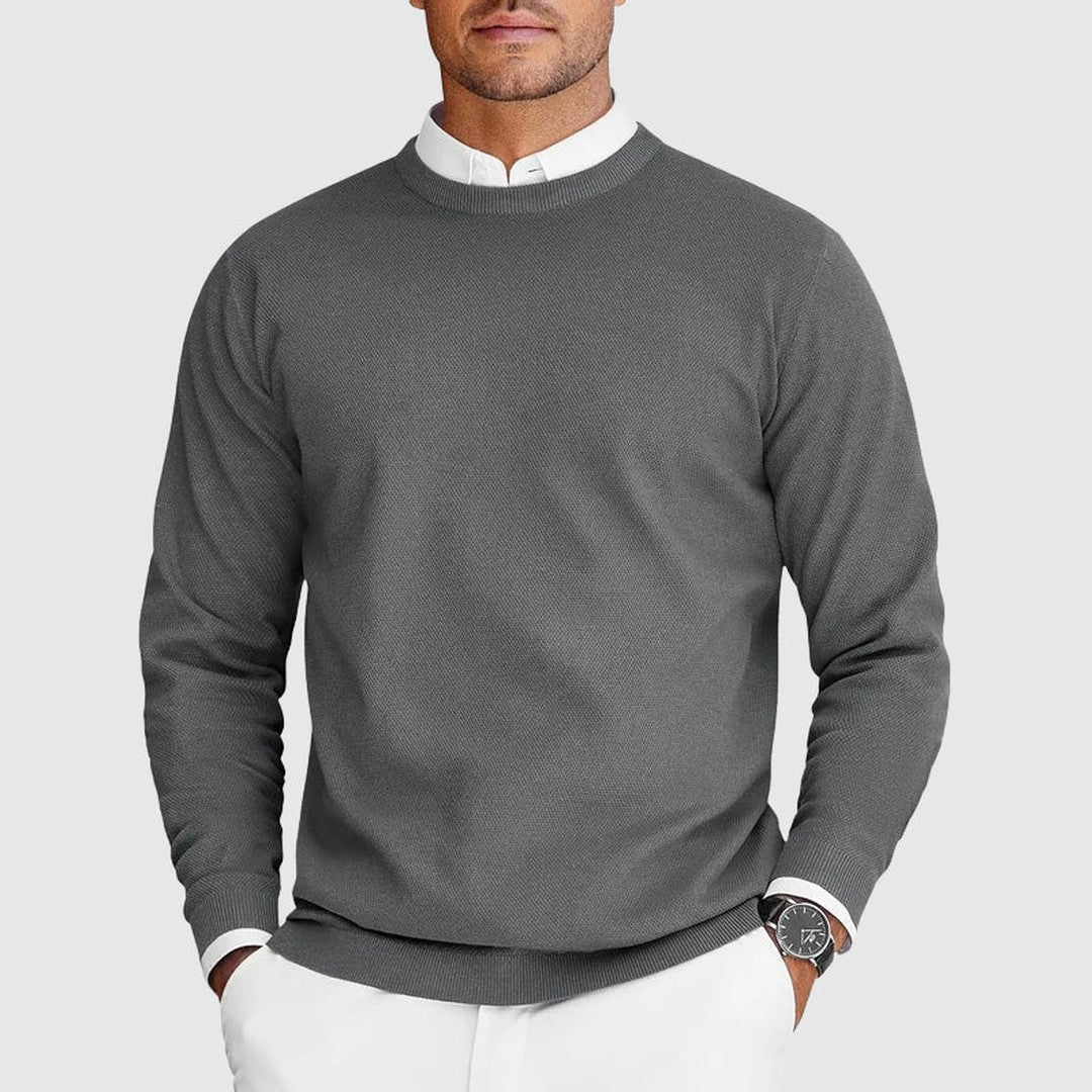 Man wearing the Ezra men's crewneck sweater, detail view