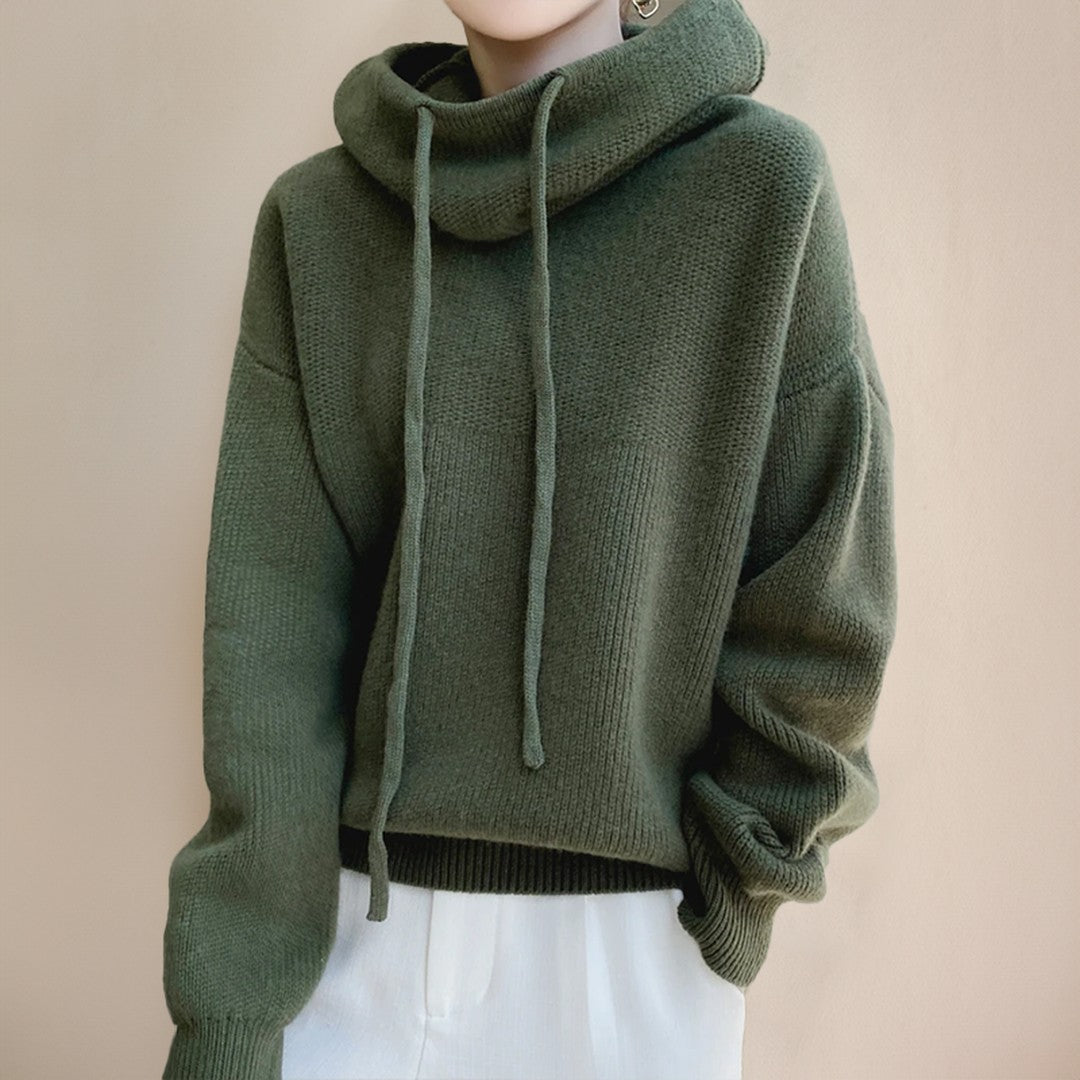 Woman wearing the Farrah women's oversized mock-neck knit sweater, front view
