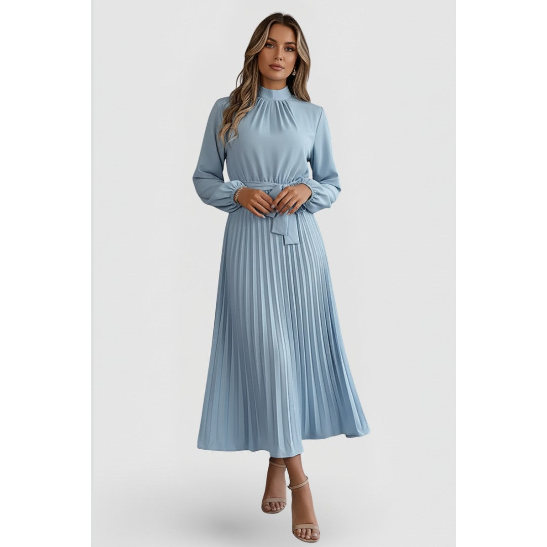 Woman wearing the Felix women's pleated dress, back view