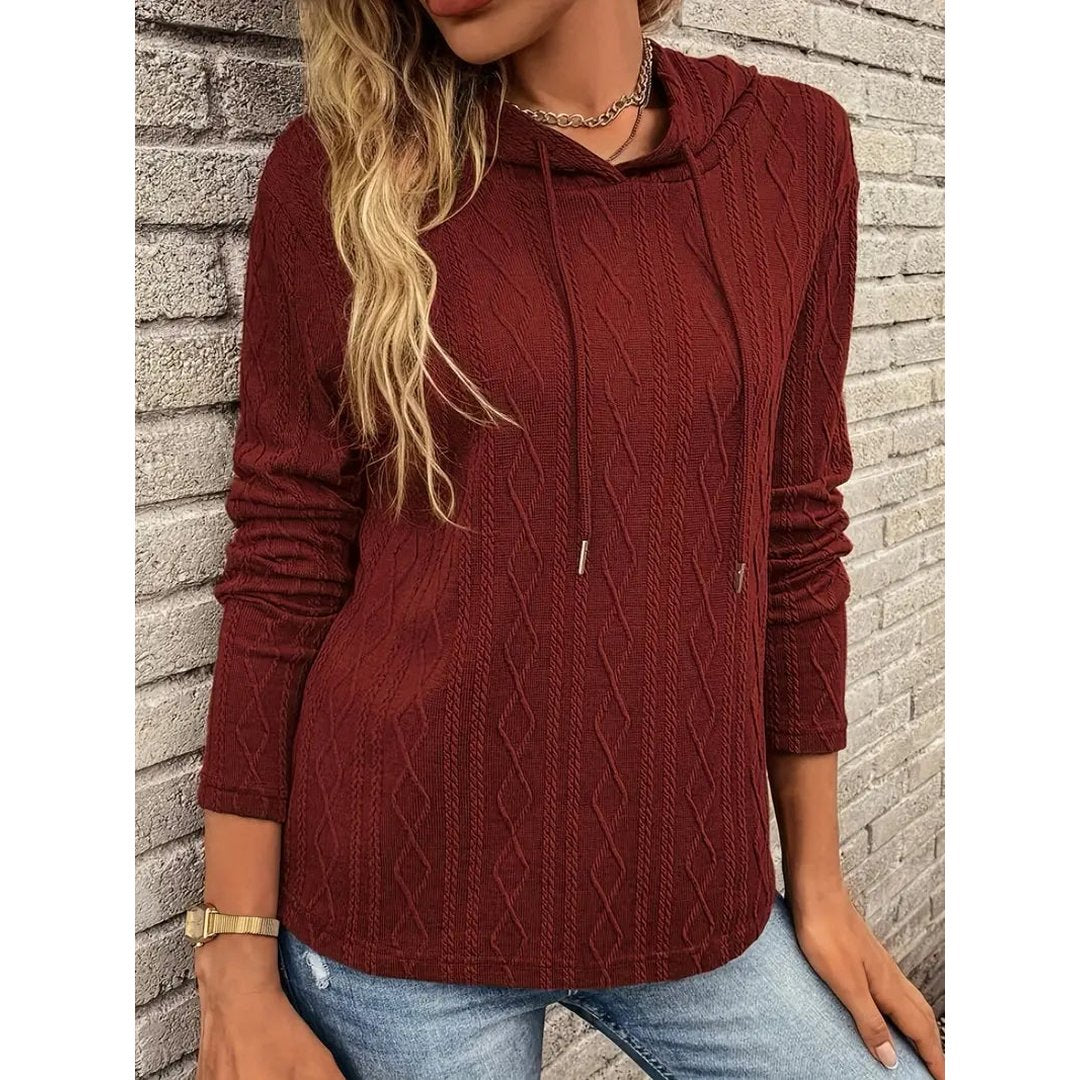 Woman wearing the Flora women's hooded hoodie, back view