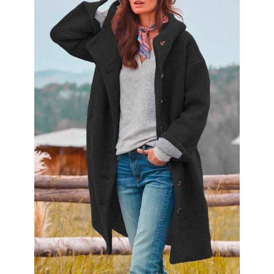 Woman wearing the Freya women's hooded coat, side view