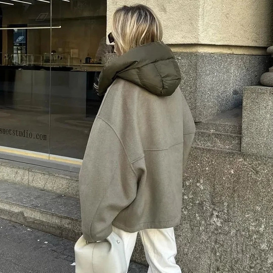 Woman wearing the Gaia women's relaxed hooded jacket, back view