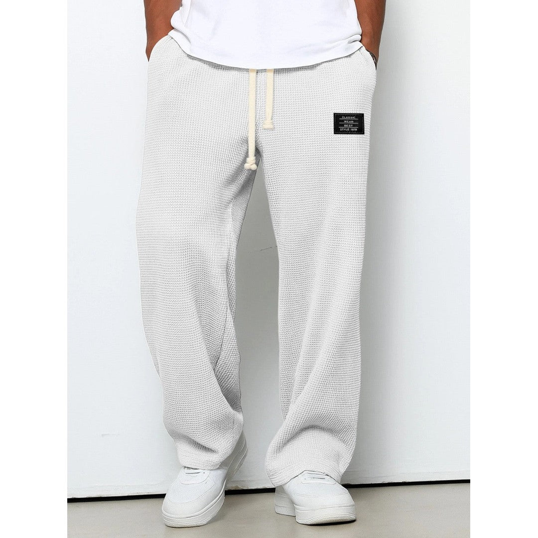 Man wearing the Gerard men's relaxed denim breathable pants, back view