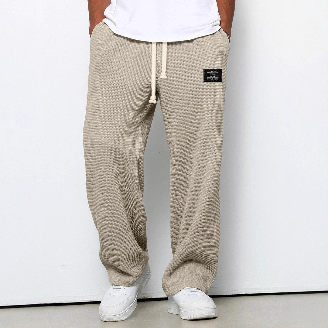 Man wearing the Gerard men's relaxed denim breathable pants, detail view