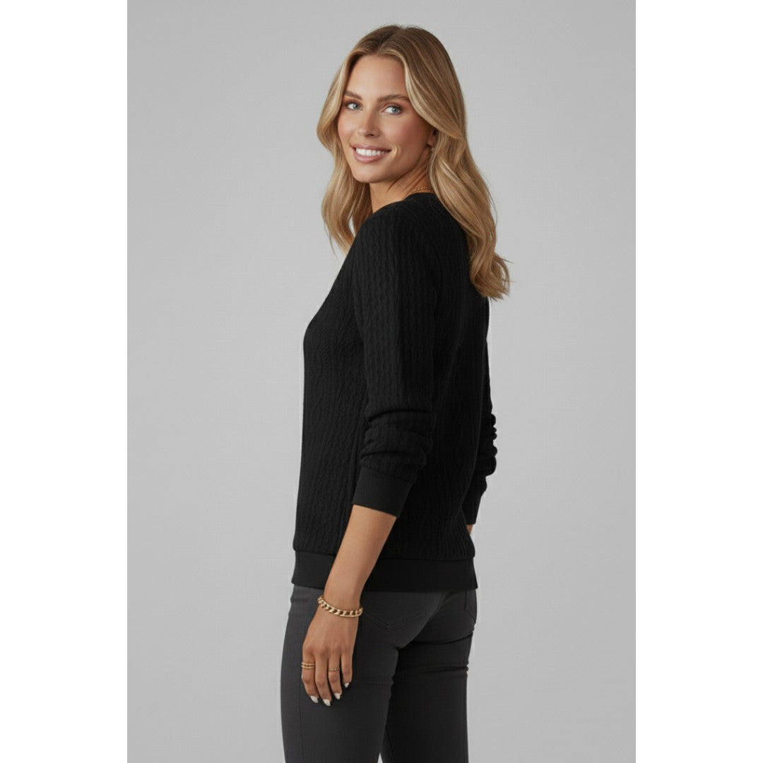 Woman wearing the Josefina women's knit zip-up sweater, side view