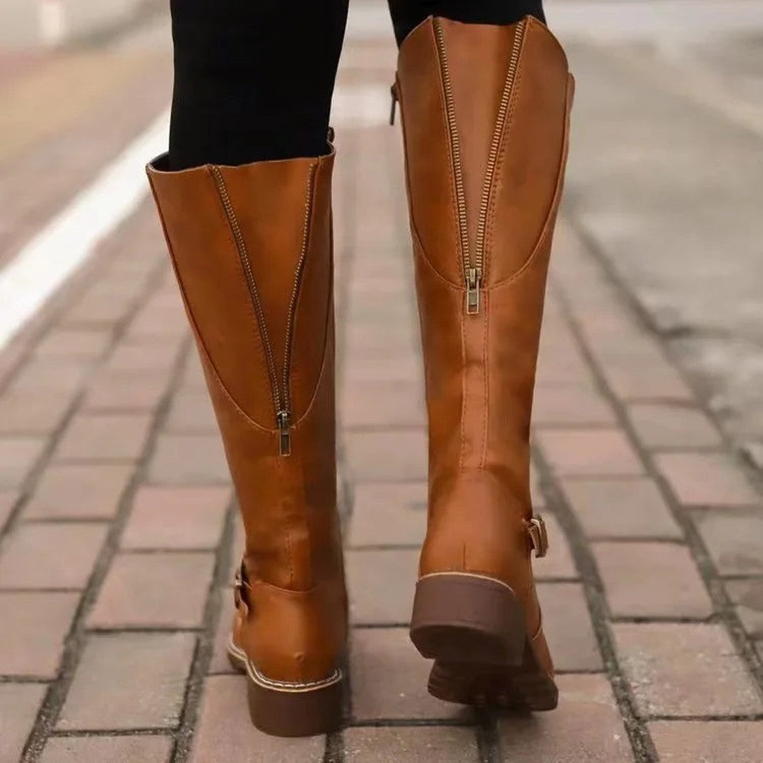 Woman wearing the Melisande women's classic boots, flatlay view