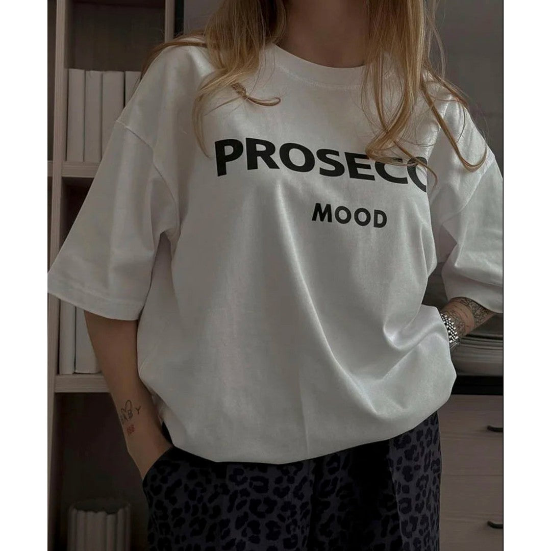 Woman wearing the Nova women's t-shirt, back view