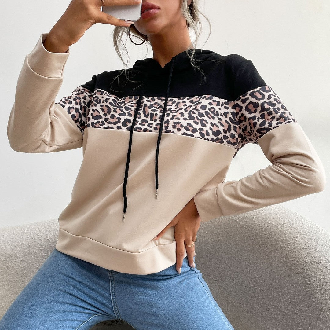 Woman wearing the Ottilie women's hooded hoodie, side view
