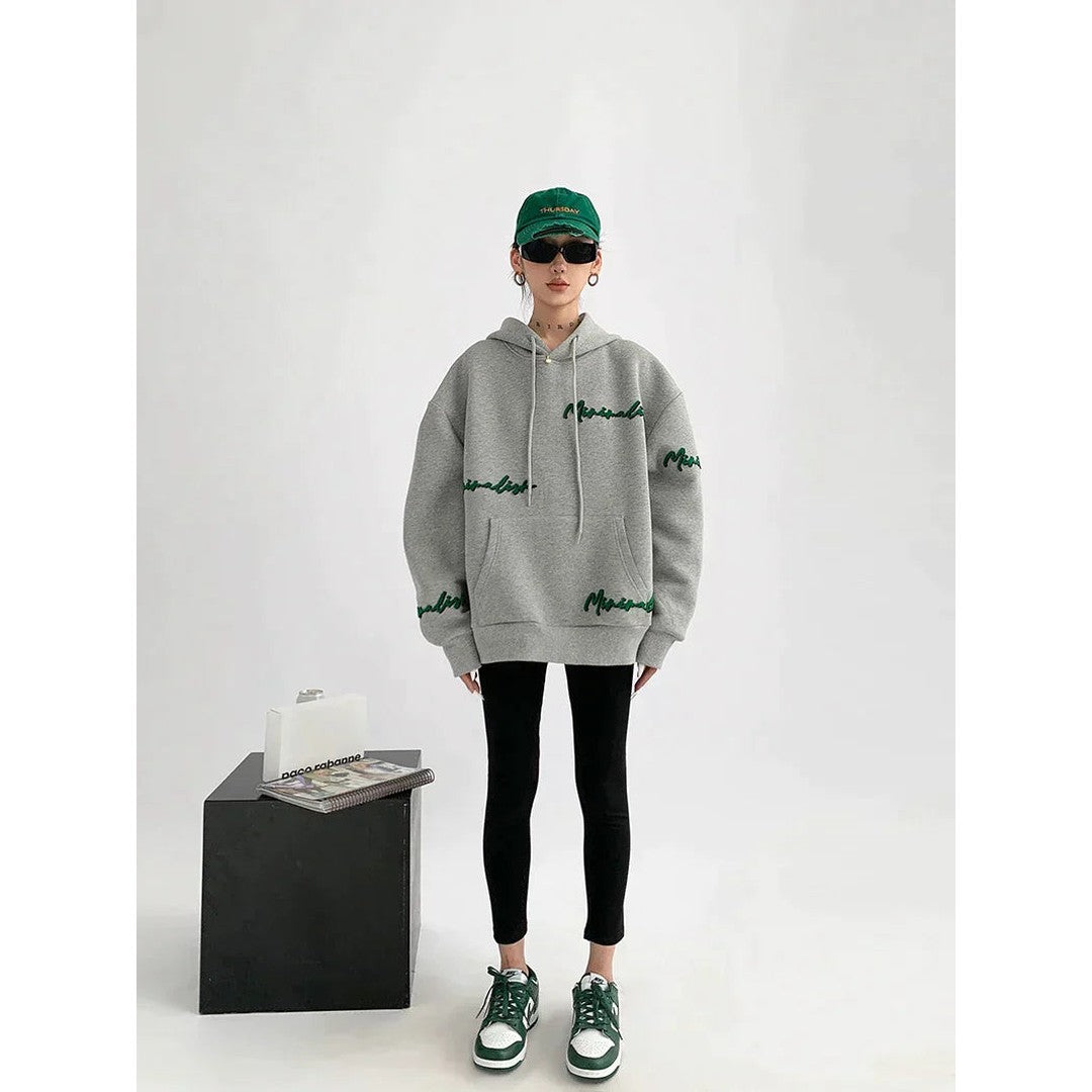 Woman wearing the Romilly women's hoodie, back view
