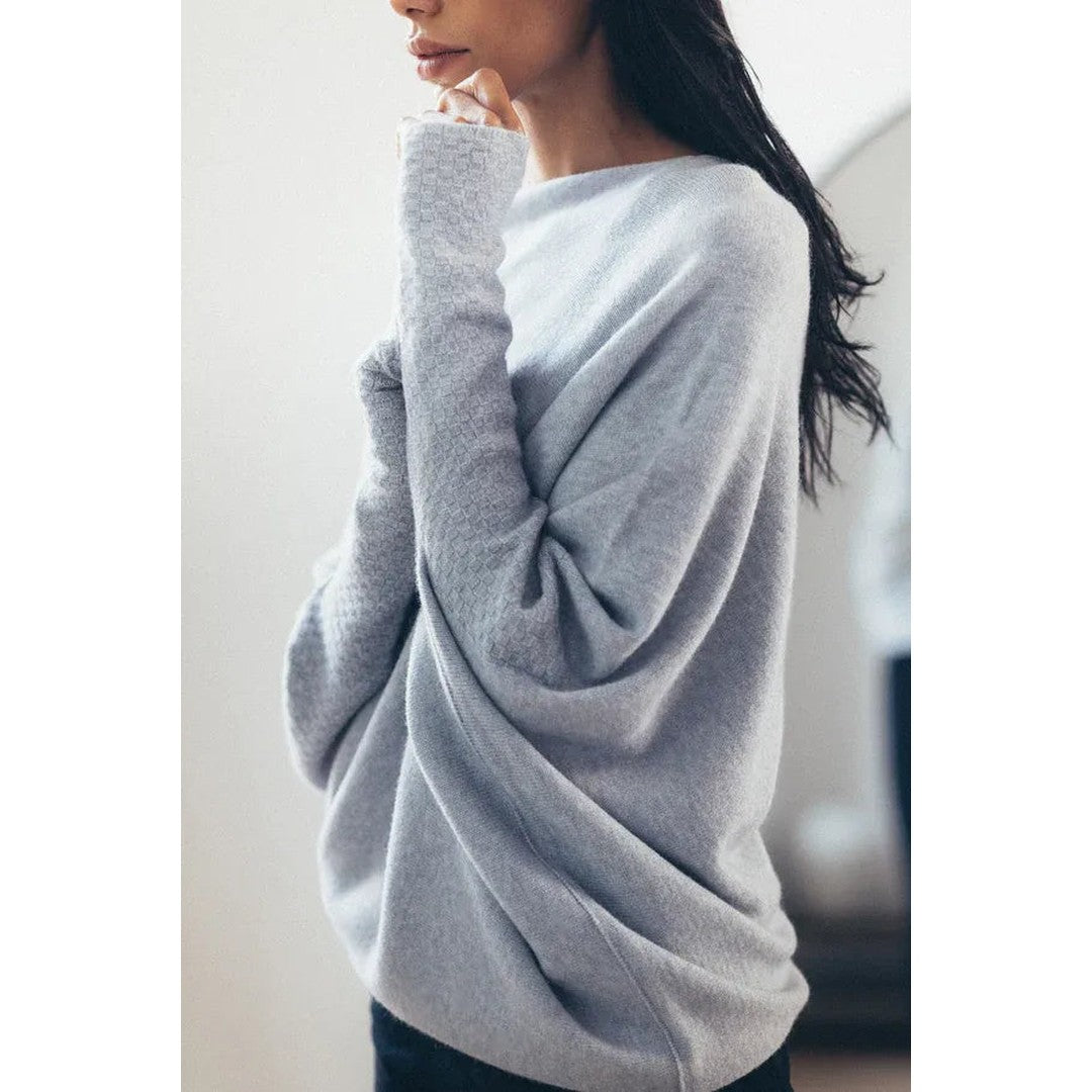 Woman wearing the Romy women's knit sweater, front view