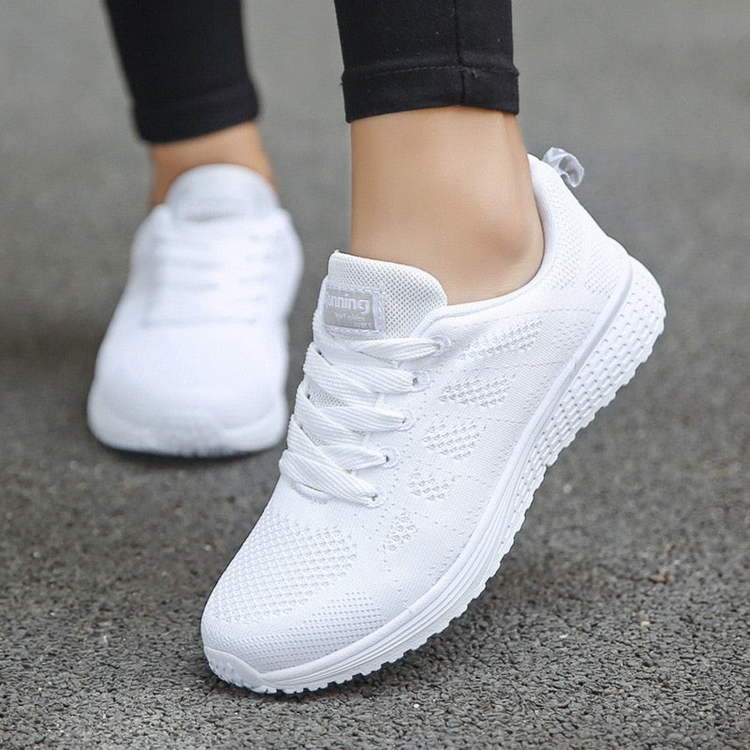 Woman wearing the Runa women's casual shoes, flatlay view
