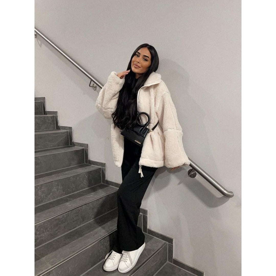 Woman wearing the Sadie women's oversized zip-up jacket, back view