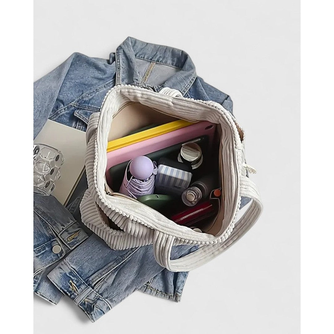 Woman wearing the Sarah women's bag, flatlay view