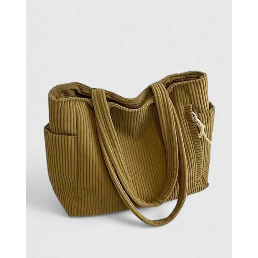 Woman wearing the Sarah women's bag, side view
