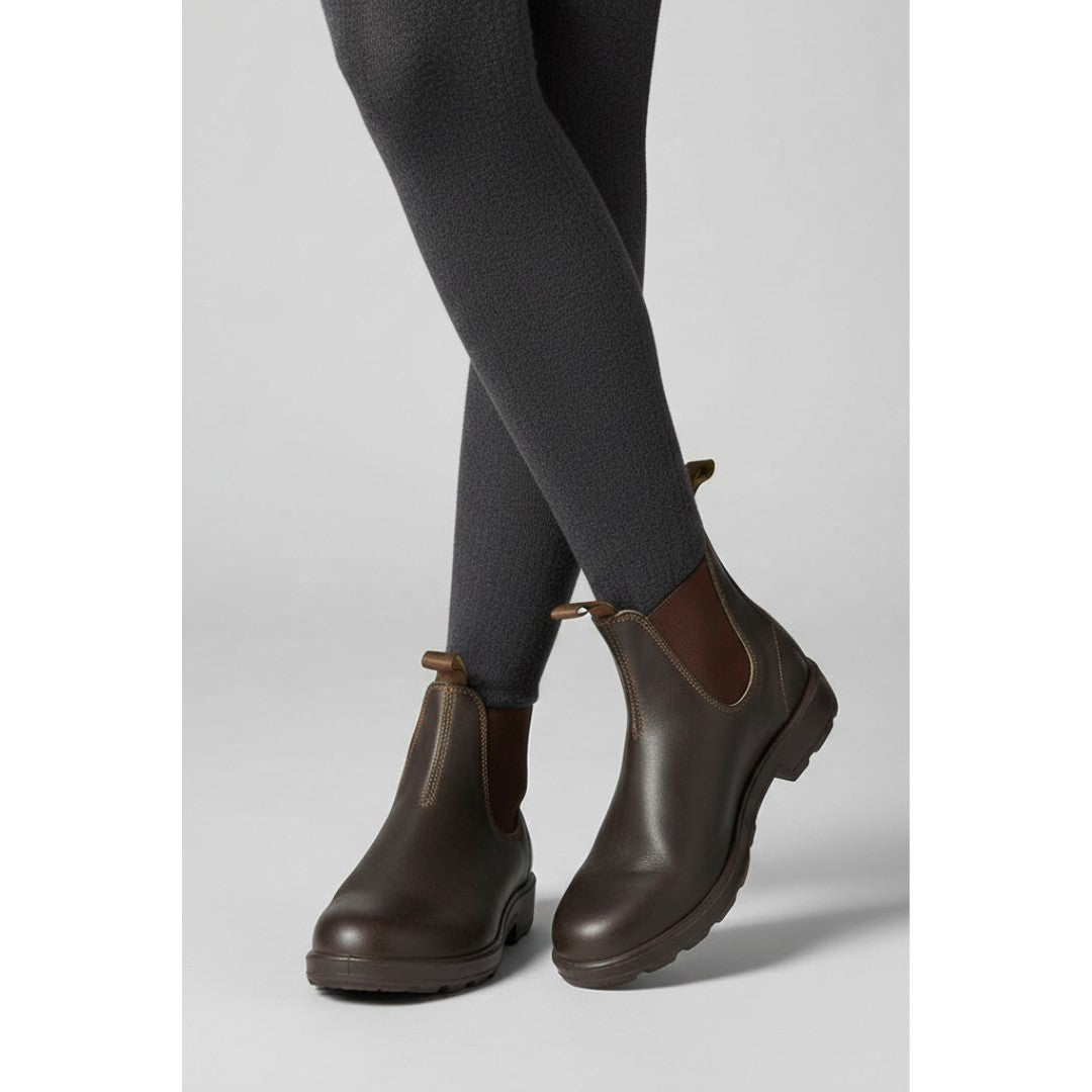 Woman wearing the Thorne women's boots, flatlay view