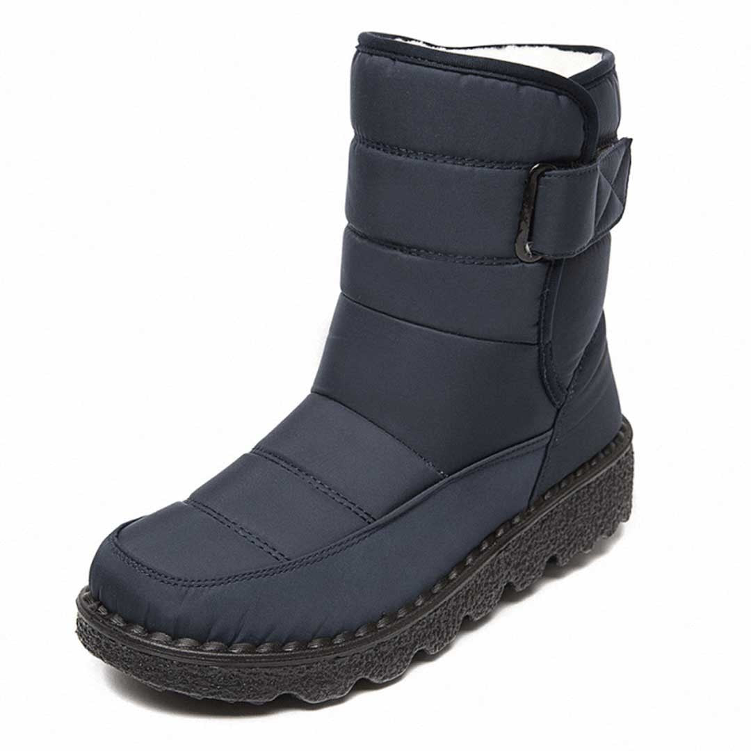 Woman wearing the Uma women's waterproof boots, flatlay view