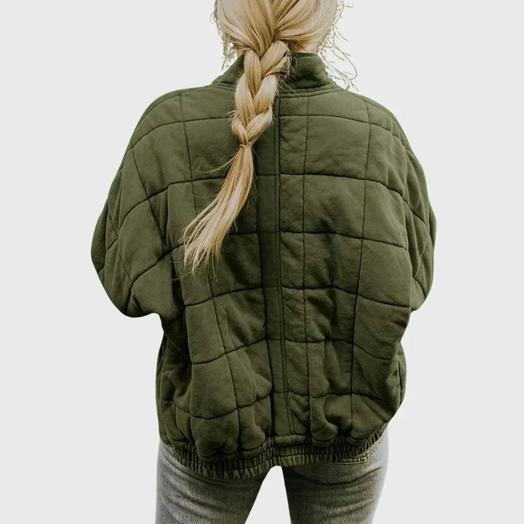 Man wearing the Wolfgang men's quilted jacket, back view