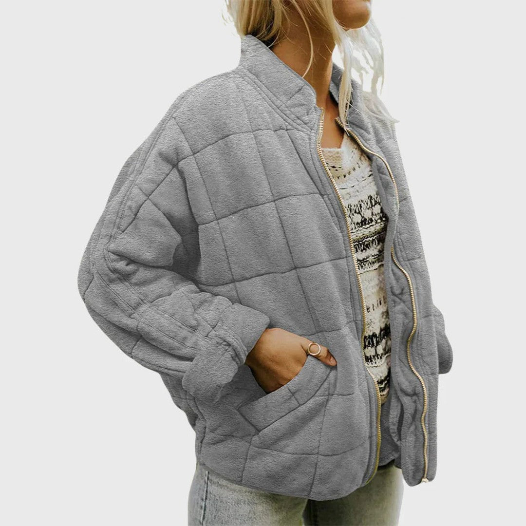 Man wearing the Wolfgang men's quilted jacket, detail view
