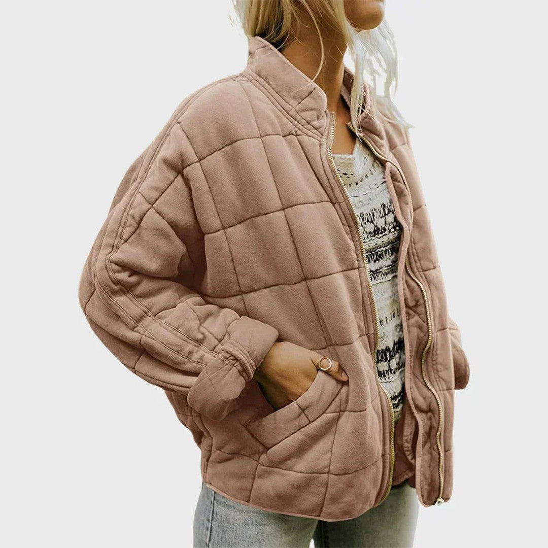 Man wearing the Wolfgang men's quilted jacket, flatlay view