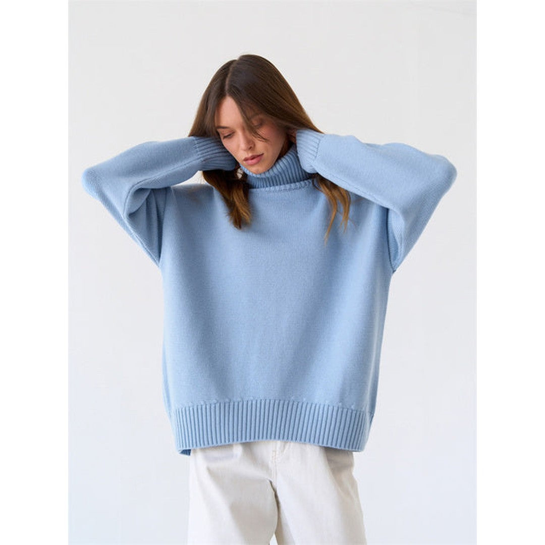 Woman wearing the Xanthe women's turtleneck knit sweater, back view
