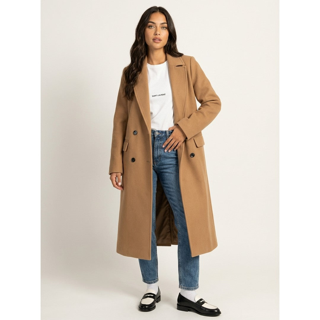 Woman wearing the Ylva women's long-sleeve coat, model view