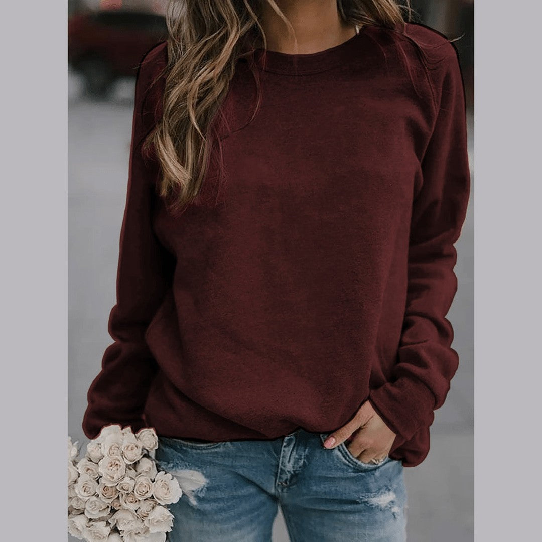 Woman wearing the Alba women's sweater, side view