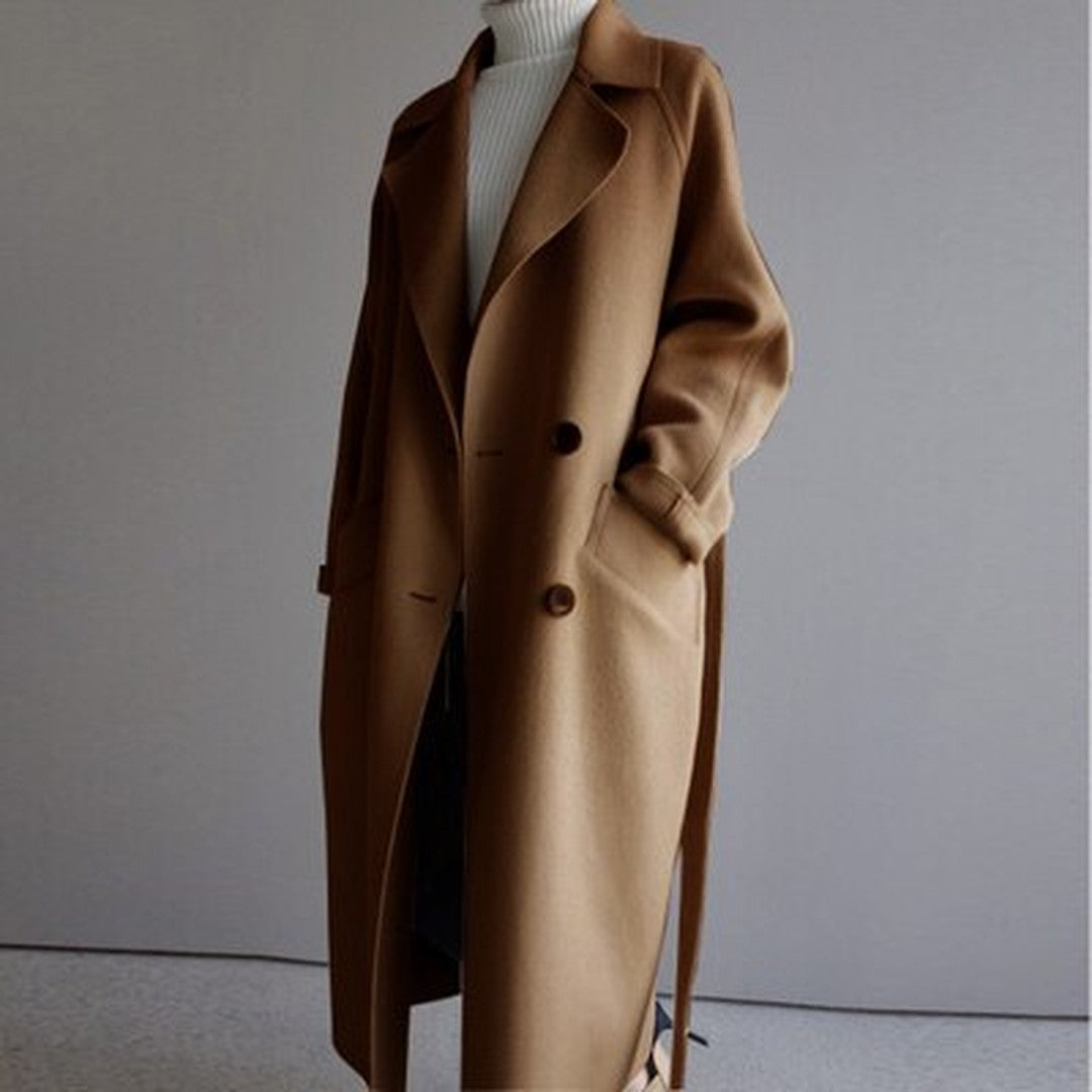 Woman wearing the Arwen women's wool long-sleeve coat, side view