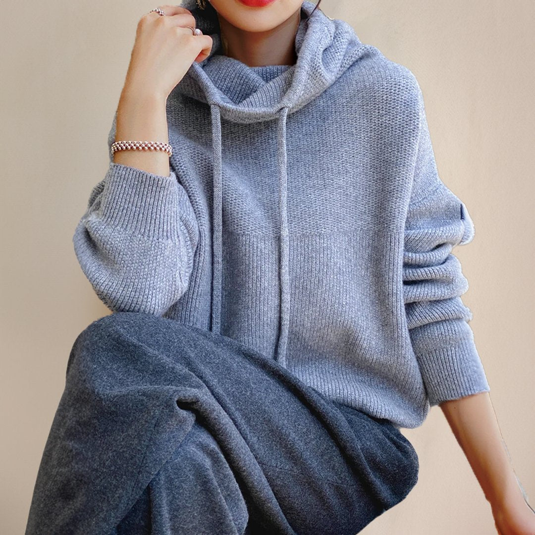 Woman wearing the Briar women's knit hoodie, front view