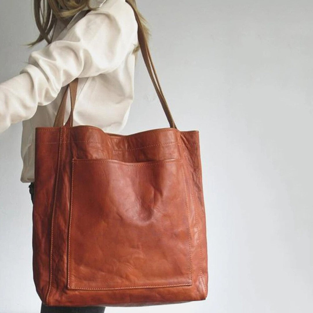 Woman wearing the Bristol women's pocket detail bag, back view