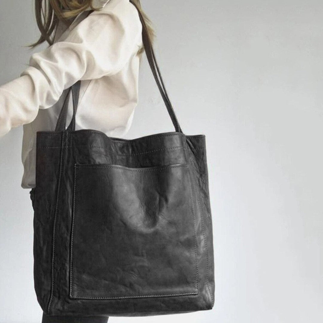 Woman wearing the Bristol women's pocket detail bag, detail view