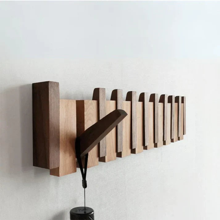 Wooden wall coat rack with fold-away piano key hooks - product photo 1