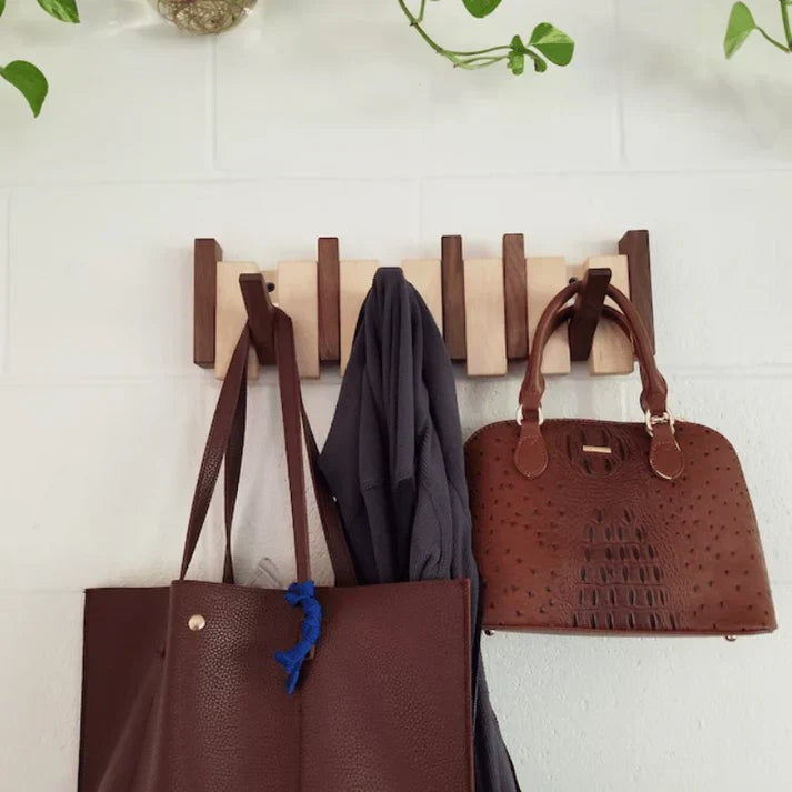 Wooden wall coat rack with fold-away piano key hooks - product photo 2