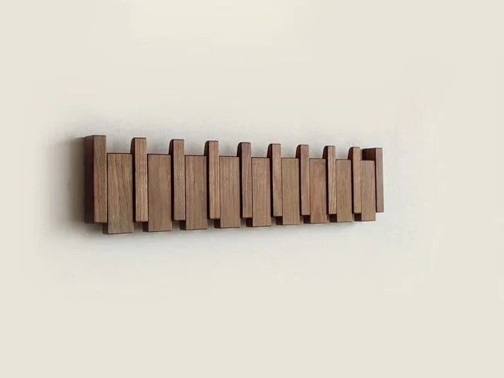 Wooden wall coat rack with fold-away piano key hooks - product photo 8
