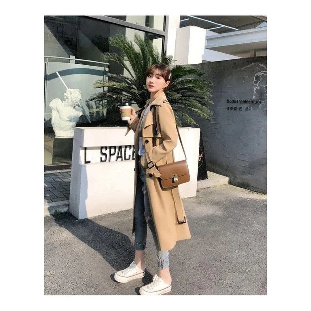 Woman wearing the Cadence women's long-sleeve trench coat, 13 view