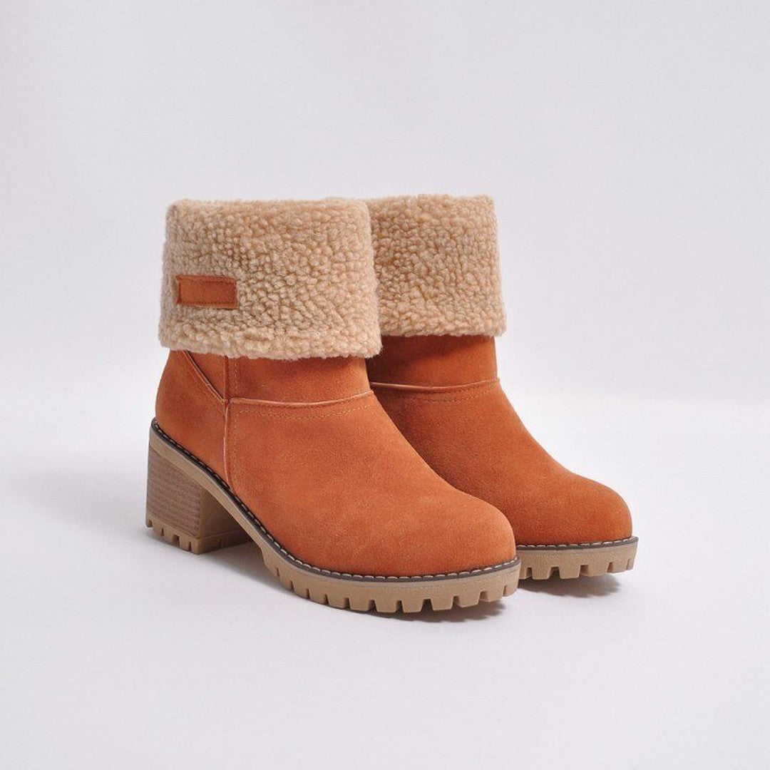 Woman wearing the Cleo women's boots in orange, detail view