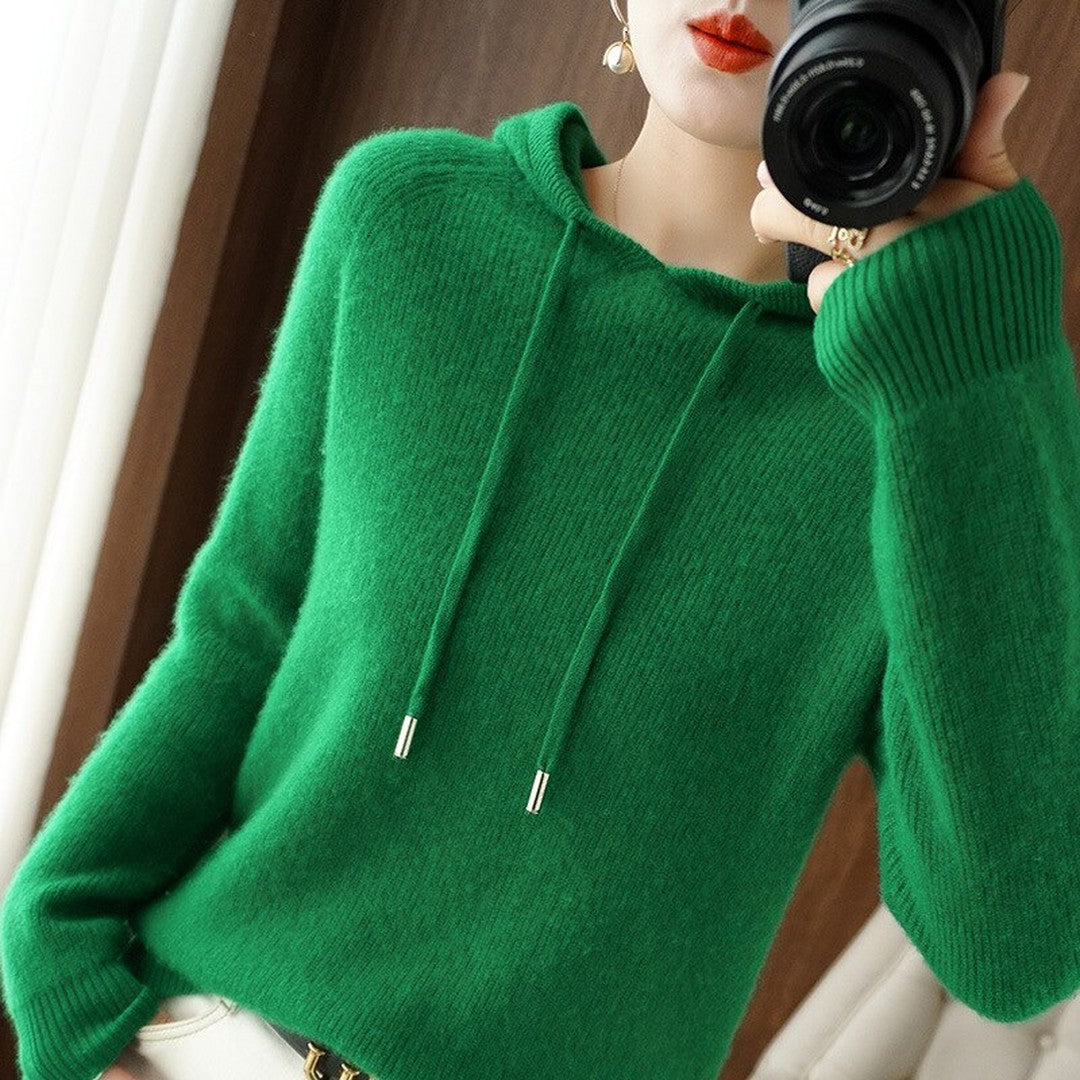 Woman wearing the Cora women's hooded cashmere hoodie, flatlay view