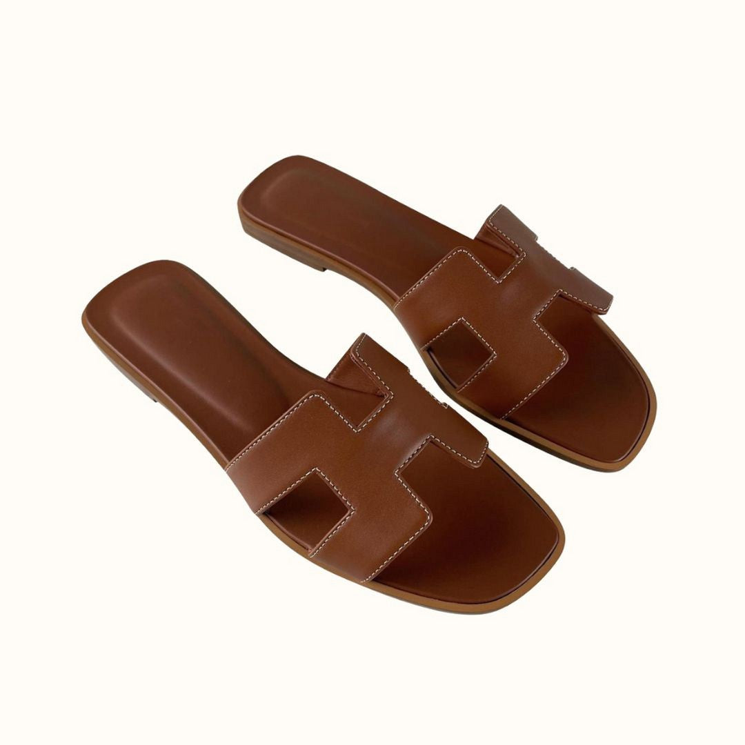 Woman wearing the Dahlia women's leather sandals, model view